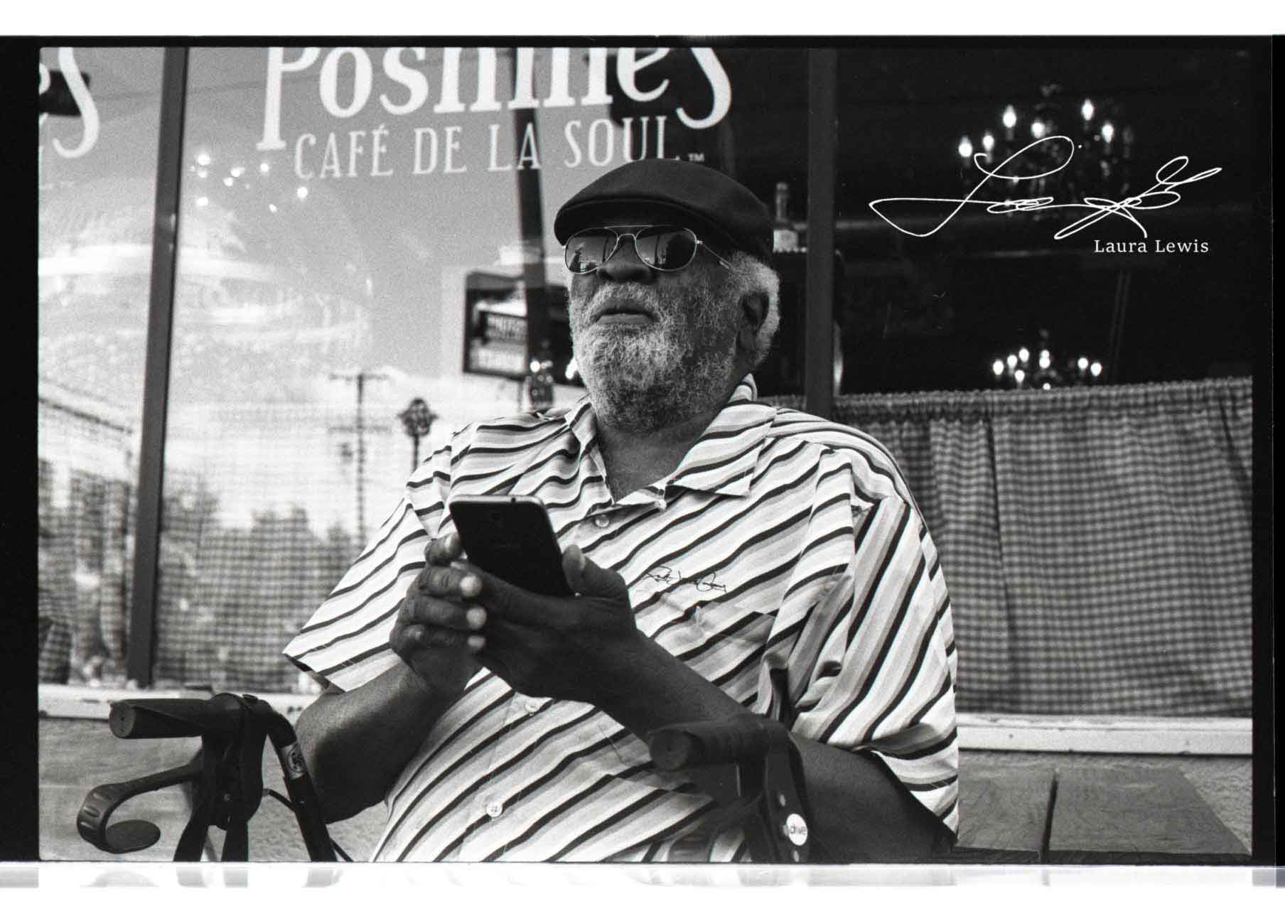 Street portrait photographed on black-and-white film