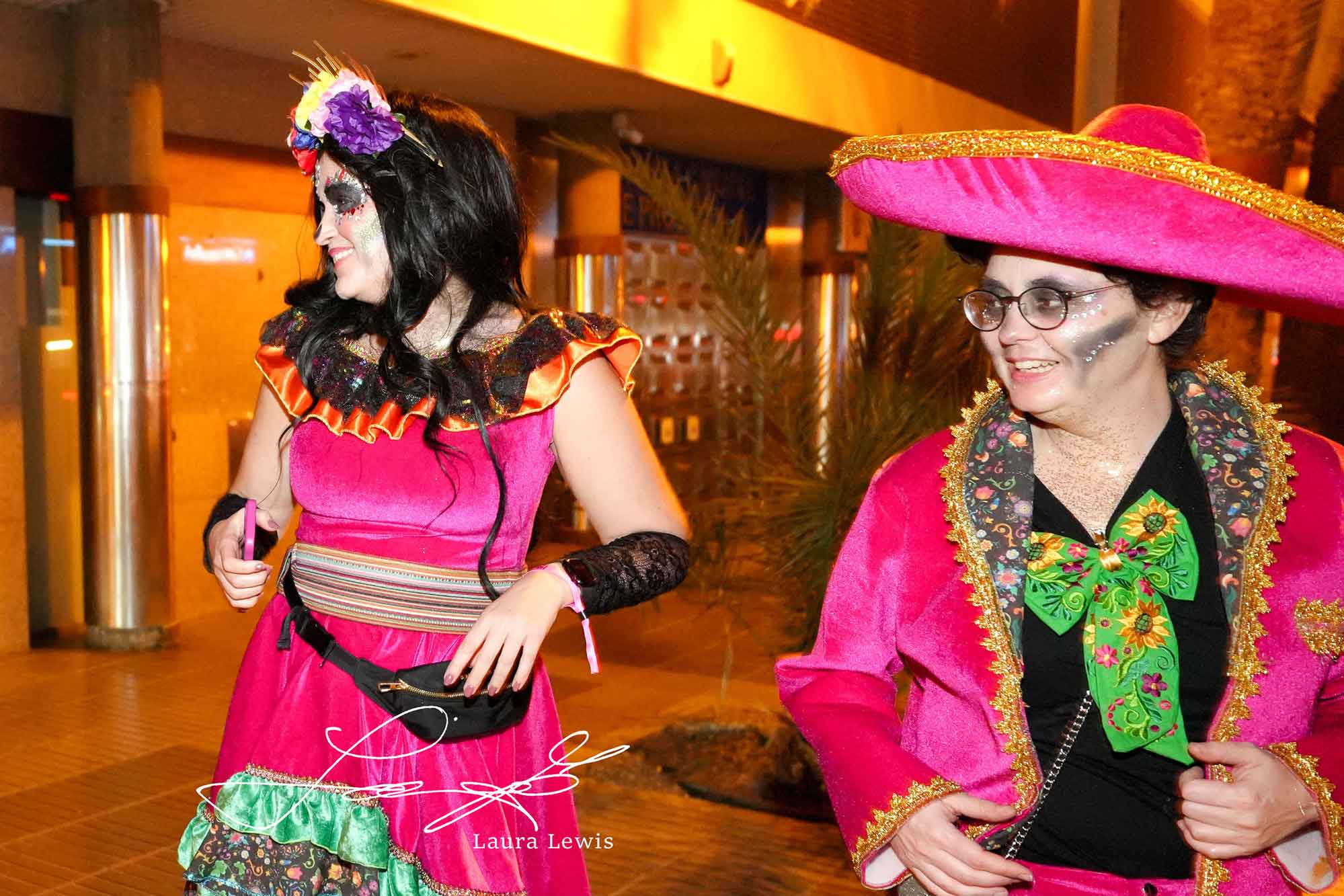 Brightly dressed friends photographed at night